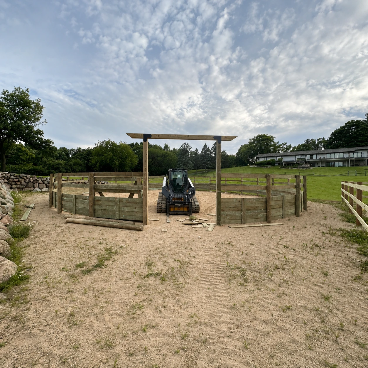 Derby fence and gate installed around a horse paddock