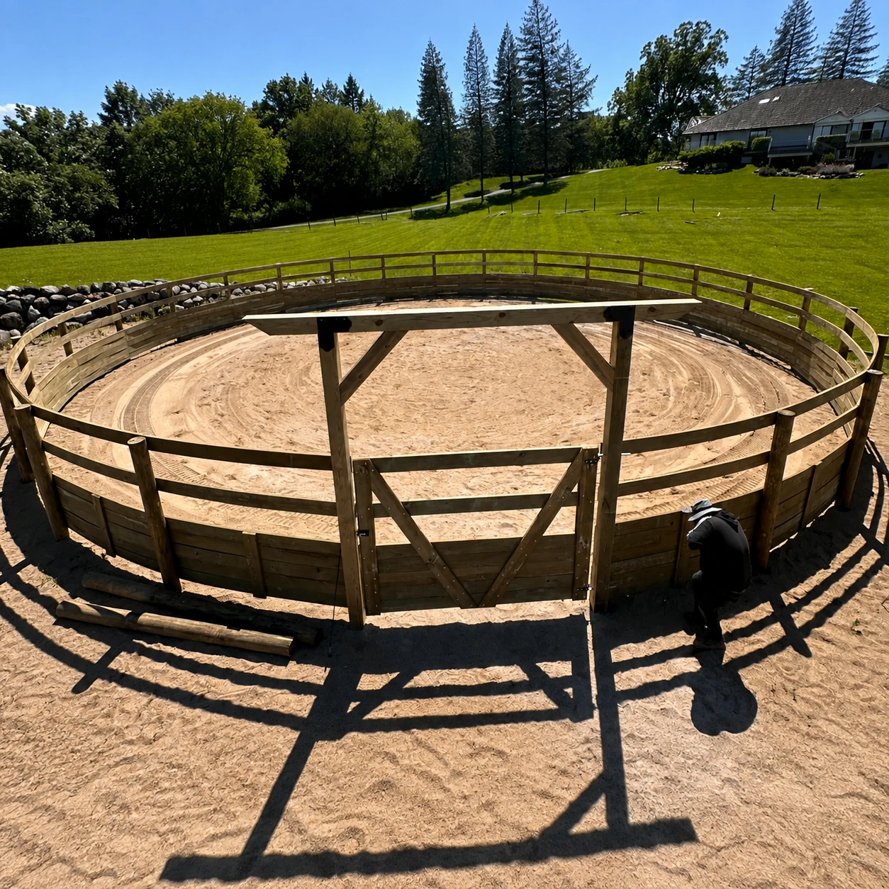 Wood fence designed around a circular livestock corral