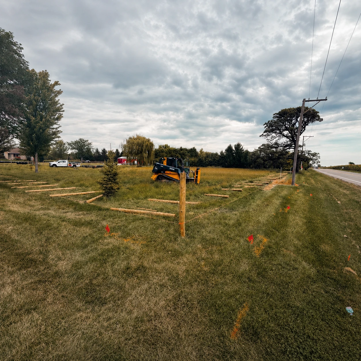 Marked fence layout and post locations on a rural property