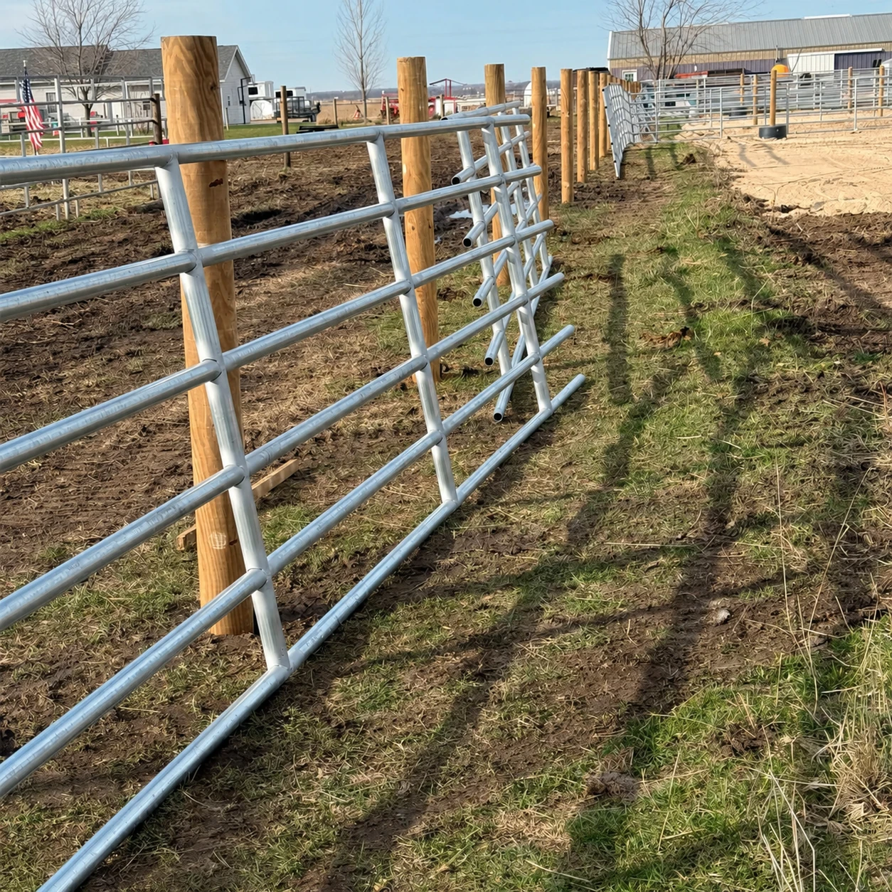 Ranch fencing and livestock gates installed around a handling area