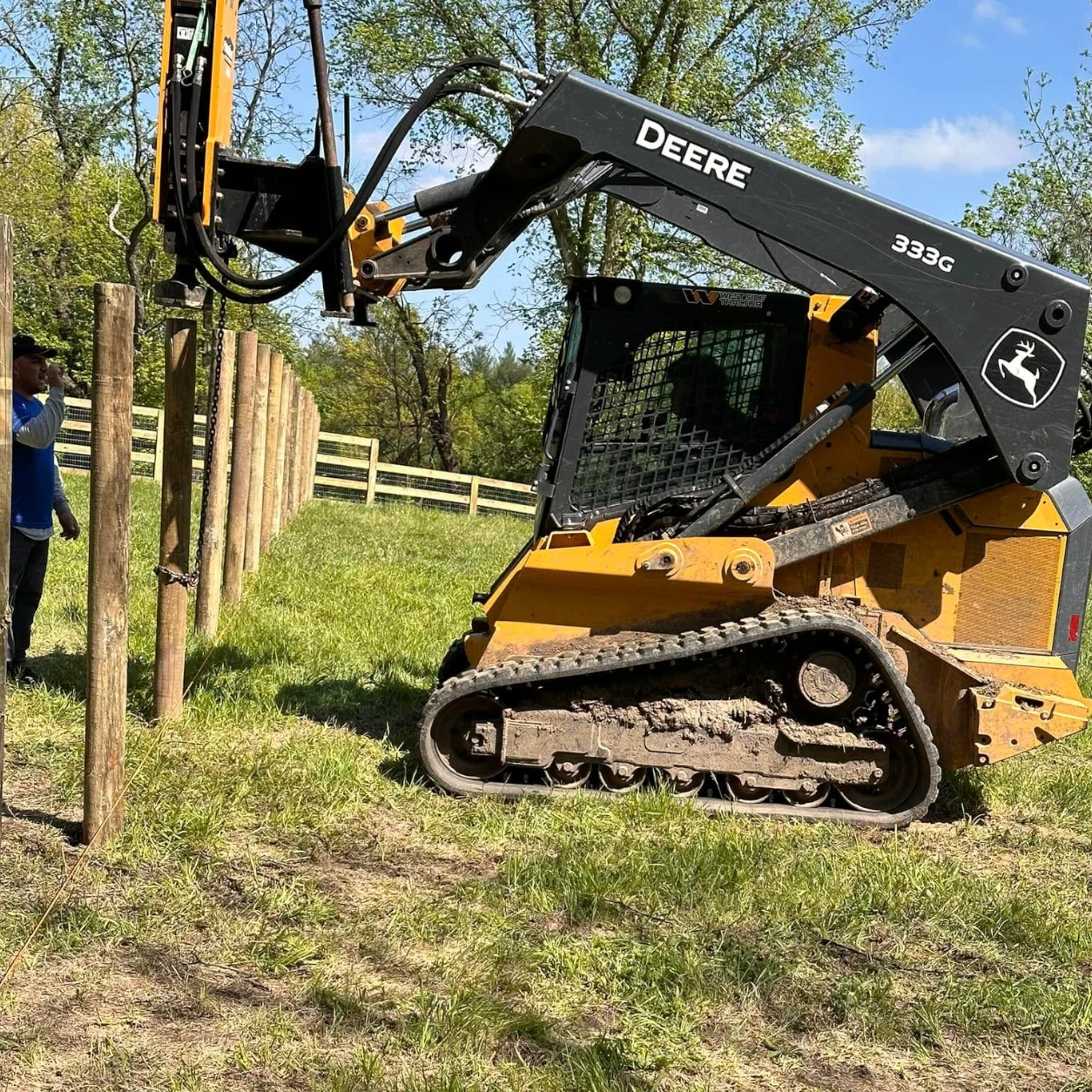 Residential farm fence installation around a rural home